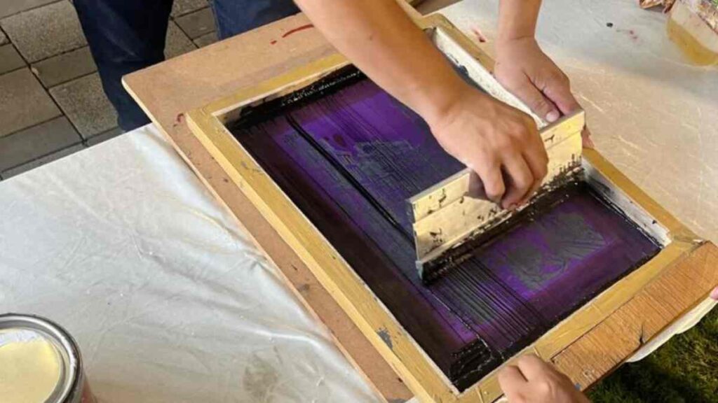 Screen printing process in action.
