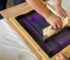 Screen printing process in action.